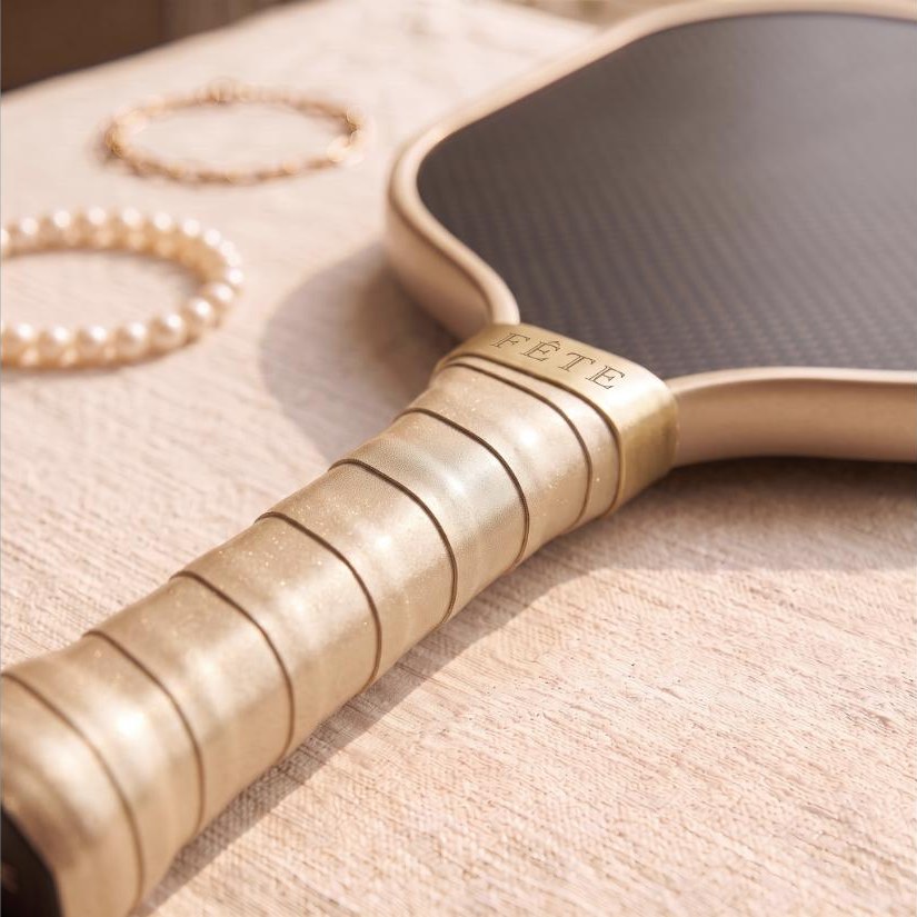 Soft-focus preview of the Court Queen champagne overgrip