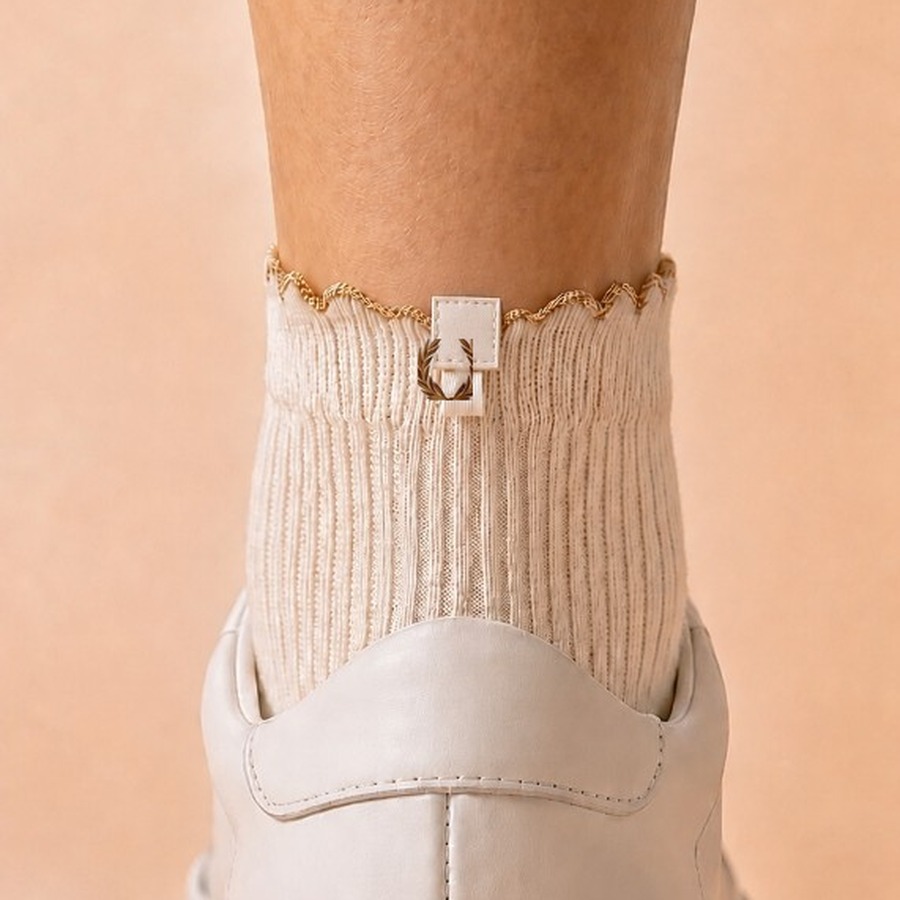 Soft-focus preview of the SockLock heel with gold laurel mark